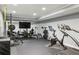 Fully equipped home gym with weightlifting equipment, treadmill, and mirrored wall at 6175 Weatherly Dr, Sandy Springs, GA 30328