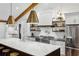 Bright kitchen with marble counters, stainless steel appliances, and open shelving at 6175 Weatherly Dr, Sandy Springs, GA 30328