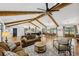 Bright living room with vaulted ceiling, wood beams, open floor plan and hardwood floors at 6175 Weatherly Dr, Sandy Springs, GA 30328