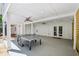Outdoor patio with a ping pong table and ceiling fans for entertainment at 6175 Weatherly Dr, Sandy Springs, GA 30328