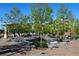 Charming patio area with tables and chairs under mature trees at 6175 Weatherly Dr, Sandy Springs, GA 30328
