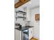 Elegant wet bar with granite countertop, wine storage and cooler, and white subway tile backsplash at 6175 Weatherly Dr, Sandy Springs, GA 30328