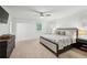 Bright bedroom features carpet floors, ceiling fan and two windows with shutters at 6175 Weatherly Nw Dr, Sandy Springs, GA 30328