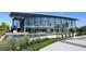 Modern performing arts center featuring floor-to-ceiling glass windows and reflecting pool at 6175 Weatherly Nw Dr, Sandy Springs, GA 30328