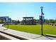 Beautiful community green with open-air stage and lawn area for events and recreation at 6175 Weatherly Nw Dr, Sandy Springs, GA 30328