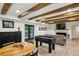Entertaining game room with foosball table, fireplace, and direct access to the backyard at 6175 Weatherly Nw Dr, Sandy Springs, GA 30328