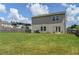 Expansive backyard with lush green grass and privacy fence, perfect for outdoor activities at 15 Regal Ln, Covington, GA 30016