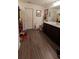 Bathroom has wood flooring and single vanity at 15 Regal Ln, Covington, GA 30016