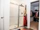Bathroom with a glass-enclosed shower and a view into the closet at 15 Regal Ln, Covington, GA 30016