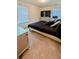 Well-lit bedroom with a large bed, neutral carpet, and a window for natural light at 15 Regal Ln, Covington, GA 30016