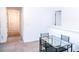 Bright dining area featuring a modern glass table and carpet flooring at 15 Regal Ln, Covington, GA 30016