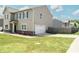 Well-maintained home with an attached garage and a spacious, neatly manicured lawn at 15 Regal Ln, Covington, GA 30016