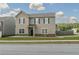 Charming two-story home features a welcoming front porch and beautifully landscaped front yard at 15 Regal Ln, Covington, GA 30016