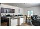 Modern kitchen featuring a granite island, updated appliances, and ample cabinet space at 15 Regal Ln, Covington, GA 30016