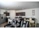 Open-concept kitchen with stainless steel appliances and granite countertops, perfect for entertaining at 15 Regal Ln, Covington, GA 30016