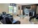 Bright living room featuring elegant furniture, a cozy fireplace, and modern decor at 15 Regal Ln, Covington, GA 30016