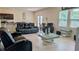 Bright living room with modern furnishings and a view to the kitchen and patio at 15 Regal Ln, Covington, GA 30016