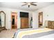 Spacious bedroom with a ceiling fan, carpet floors, and ample closet space at 15 Regal Ln, Covington, GA 30016