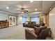 Spacious finished basement with a cozy seating area and recessed lighting at 215 Settindown Ct, Roswell, GA 30075