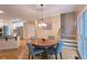 Breakfast area next to kitchen provides an eat-in dining space with natural light from adjacent windows and a view of stairs at 215 Settindown Ct, Roswell, GA 30075