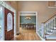 Grand entryway showcasing hardwood floors and a formal dining area at 215 Settindown Ct, Roswell, GA 30075