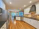 Bright kitchen with stainless steel appliances, granite countertops, and hardwood floors at 215 Settindown Ct, Roswell, GA 30075