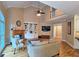 Open living room with fireplace, built-in shelves, and a two-story vaulted ceiling, creating an inviting space at 215 Settindown Ct, Roswell, GA 30075