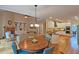 Open concept living room, dining, and kitchen area provides lots of space for entertaining at 215 Settindown Ct, Roswell, GA 30075
