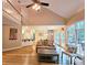 Expansive living room with hardwood floors, vaulted ceiling, access to balcony, and a view of the outdoor patio at 215 Settindown Ct, Roswell, GA 30075
