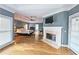 Spacious main bedroom featuring hardwood floors, fireplace, trey ceilings and lots of natural light at 215 Settindown Ct, Roswell, GA 30075