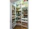 Pantry with white shelving and a variety of food items at 215 Settindown Ct, Roswell, GA 30075