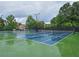 View of the neighborhood tennis court on a cloudy day at 215 Settindown Ct, Roswell, GA 30075