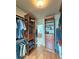 Walk-in closet with custom shelving, great for organization, hardwood floors and access to bathroom at 215 Settindown Ct, Roswell, GA 30075