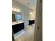 Bathroom featuring double vanities, tile floor, and a bright, clean design at 2208 Ginger Lake Ne Dr, Conyers, GA 30013