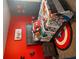 themed bedroom featuring superhero decor, red walls, a unique rug, and comic-themed bedding at 2208 Ginger Lake Ne Dr, Conyers, GA 30013