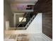 Elegant foyer with hardwood floors and decorative staircase leading to the upper level of the home at 2208 Ginger Lake Ne Dr, Conyers, GA 30013