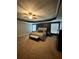 Large main bedroom with ceiling fan, many windows, and a gray bench at the foot of the bed at 2208 Ginger Lake Ne Dr, Conyers, GA 30013