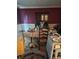 Dining room featuring red walls, carpeted floors, and dining table at 423 Orchards Walk, Stone Mountain, GA 30087