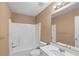 Bathroom featuring a shower-tub combo, vanity, and ample counter space, creating a functional design at 504 Bradford Park Ct, Loganville, GA 30052
