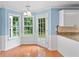 Cozy breakfast nook with large windows and a door to the backyard at 504 Bradford Park Ct, Loganville, GA 30052
