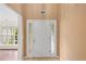 Inviting entryway with a white front door, sidelights, and tile flooring at 504 Bradford Park Ct, Loganville, GA 30052
