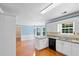 Open kitchen area with white cabinetry and granite countertops at 504 Bradford Park Ct, Loganville, GA 30052