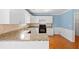 Kitchen area with granite countertops and white cabinetry at 504 Bradford Park Ct, Loganville, GA 30052