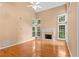 Bright living room with vaulted ceilings, a fireplace, and large windows at 504 Bradford Park Ct, Loganville, GA 30052