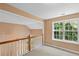 Cozy loft area offering natural light and overlooking the main level, ideal for relaxing or a home office at 504 Bradford Park Ct, Loganville, GA 30052
