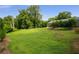 Over-sized level backyard offers endless potential for outdoor activities and entertaining at 538 Main St, Palmetto, GA 30268