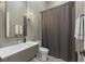 Bathroom featuring vanity with a modern sink, mirror, and walk-in shower at 538 Main St, Palmetto, GA 30268