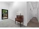 Bright entryway with antique table and views of the front yard at 538 Main St, Palmetto, GA 30268