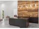 Sleek kitchen island with wood accent wall, modern lighting, and high-end fixtures at 538 Main St, Palmetto, GA 30268