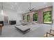 Spacious living area with modern lighting, brick wall accents, and stylish decor at 538 Main St, Palmetto, GA 30268